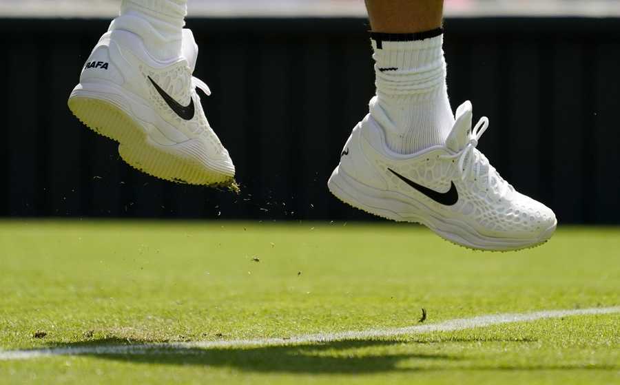 Wimbledon Tennis Week One Photo Gallery Spain's Rafael Nadal jumps up as he serves to Argentina's Francisco Cerundolo in a first round men's singles match on day two of the Wimbledon tennis championships in London, Tuesday, June 28, 2022.