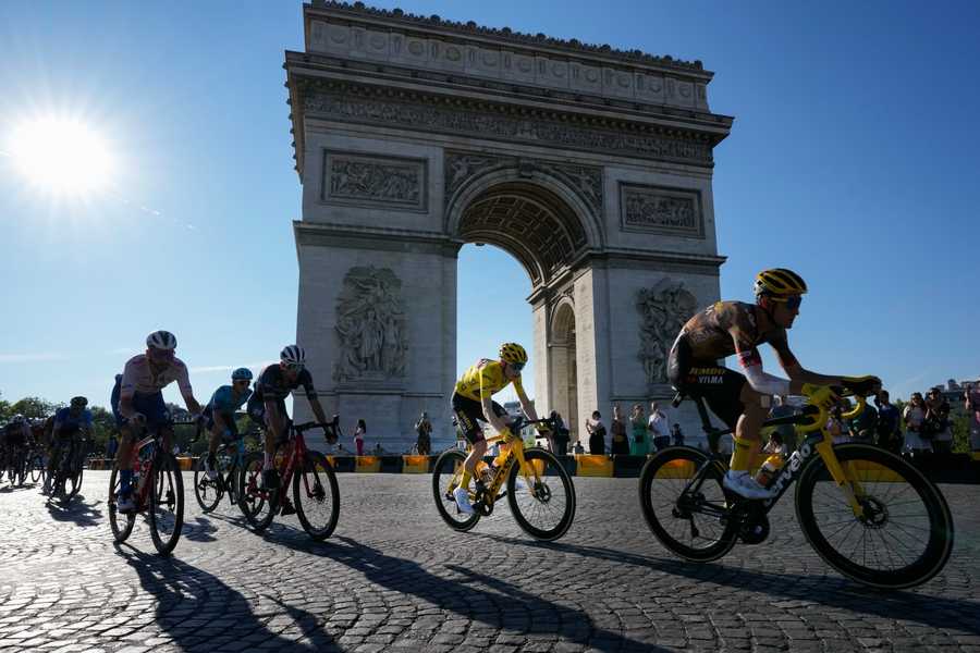 Cycling Tour de France Review Photo Gallery FILE - Denmark's Jonas Vingegaard, wearing the overall leader's yellow jersey, passes Arc de Triomphe during the twenty-first stage of the Tour de France cycling race over 116 kilometers (72 miles) with start in Paris la Defense Arena and finish on the Champs Elysees in Paris, France, Sunday, July 24, 2022.