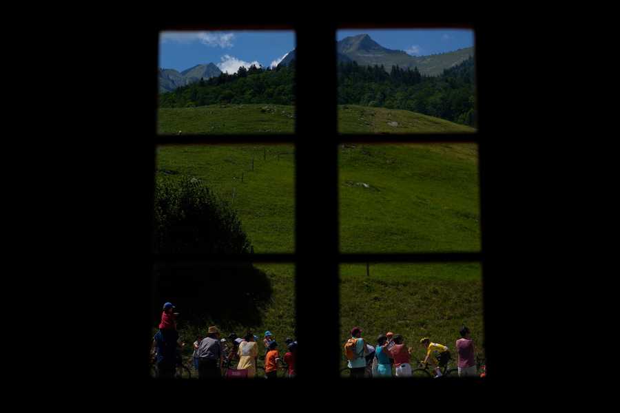 Cycling Tour de France Review Photo Gallery Spectators watch as the pack with Slovenia's Tadej Pogacar, wearing the overall leader's yellow jersey, bottom right, during the ninth stage of the Tour de France cycling race over 193 kilometers (119.9 miles) with start in Aigle, Switzerland and finish in Chatel les Portes du Soleil, France, Sunday, July 10, 2022.