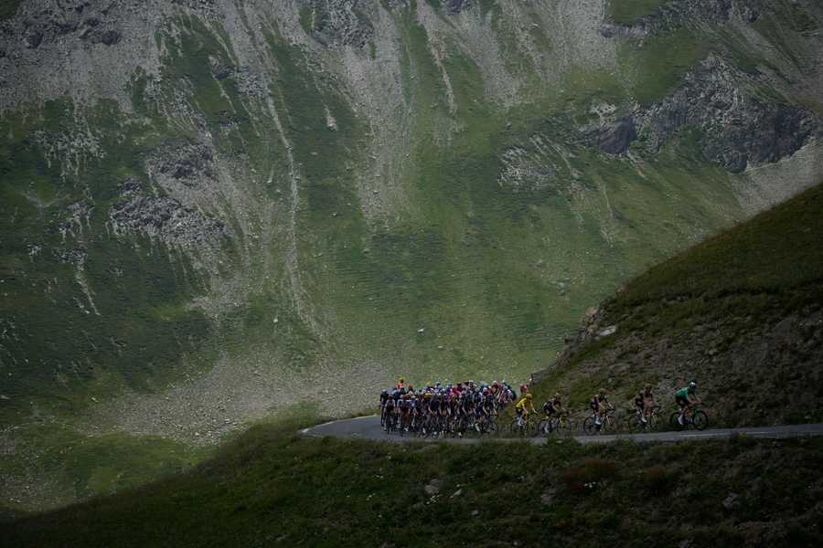 Cycling Tour de France Review Photo Gallery The pack with Denmark's Jonas Vingegaard, wearing the overall leader's yellow jersey, and Belgium's Wout Van Aert, wearing the best sprinter's green jersey, and his teammates set the pace for the pack as they climb Col du Galibier pass during the twelfth stage of the Tour de France cycling race over 165.5 kilometers (102.8 miles) with start in Briancon and finish in Alpe d'Huez, France, Thursday, July 14, 2022.