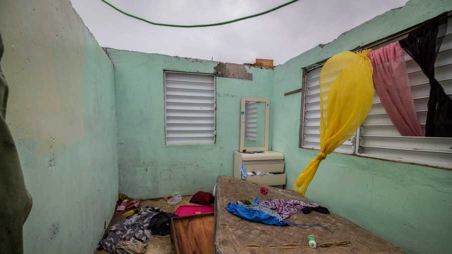 Puerto Rico Tropical Weather Nelson Cirino's home stands with its roof torn off by the winds of Hurricane Fiona in Loiza, Puerto Rico, Sunday, Sept. 18, 2022.