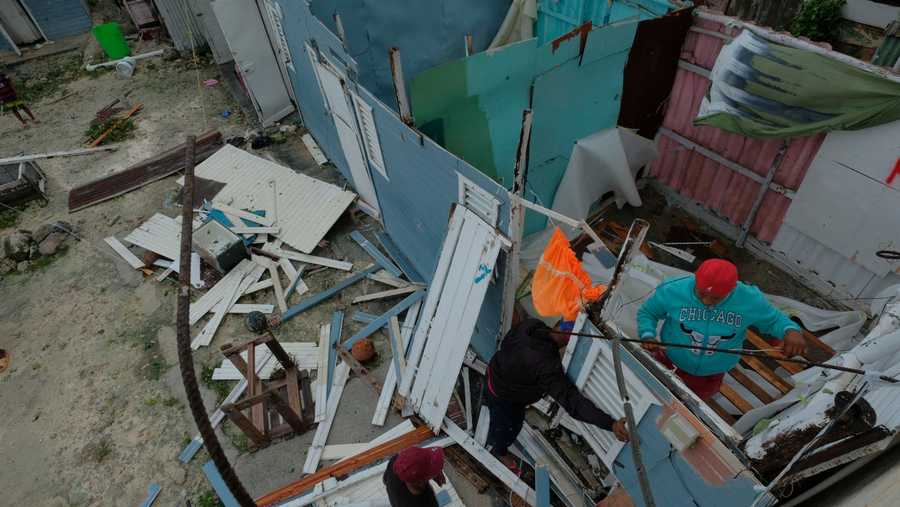 Dominican Republic Tropical Weather Residents replace a home's roof that was torn off by Hurricane Fiona in the low-income neighborhood of Kosovo in Veron de Punta Cana, Dominican Republic, Monday, Sept. 19, 2022.