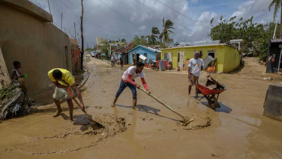 Dominican Republic Tropical Weather Locals clear mud brought by Hurricane Fiona in the Los Sotos neighborhood of Higuey, Dominican Republic, Tuesday, Sept. 20, 2022.