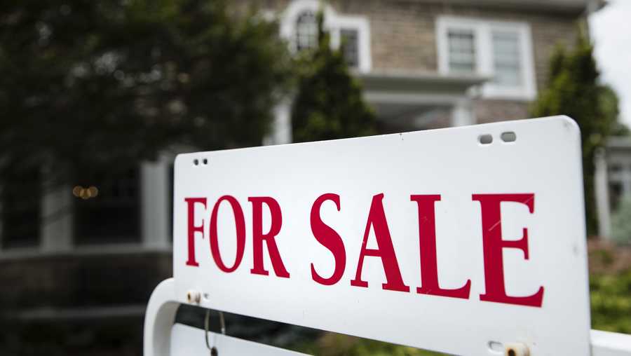 A "for sale" sign stands in front of a house in Pennsylvania, near Philadelphia, on June 8, 2018.