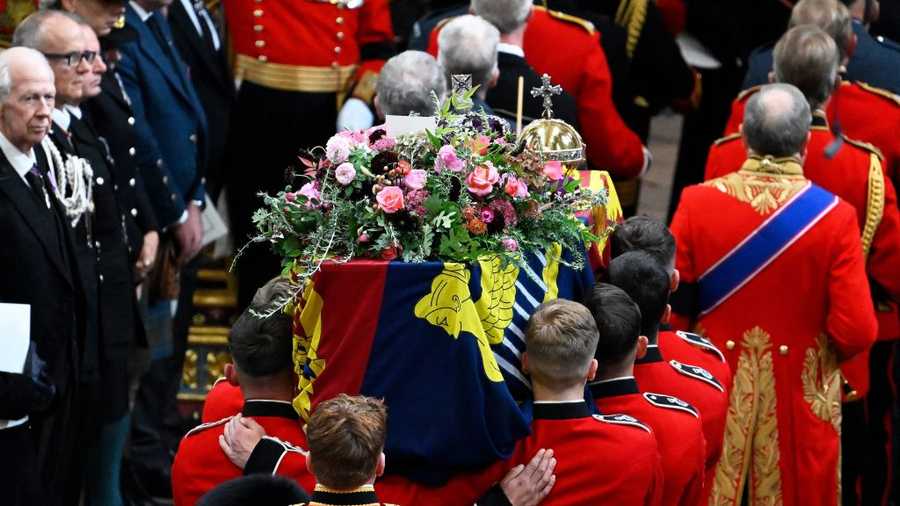 Queen Elizabeth II state funeral The coffin of Queen Elizabeth II with the Imperial State Crown resting on top is carried by the Bearer Party into Westminster Abbey during the State Funeral of Queen Elizabeth II on Sept. 19, 2022 in London, England.