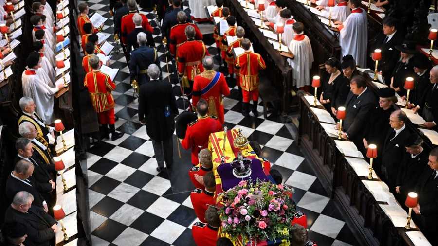 Queen Elizabeth state funeral The coffin of Queen Elizabeth II, draped in the Royal Standard, is carried inside Westminster Abbey in London on Sept. 19, 2022, ahead of the State Funeral Service.