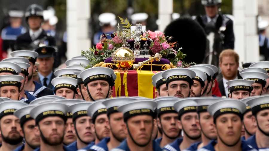 The State Funeral Of Queen Elizabeth II The coffin of Queen Elizabeth II with the Imperial State Crown resting on top surrounded by members of the Royal Navy is carried into Westminster Abbey on Sept. 19, 2022, in London, England.