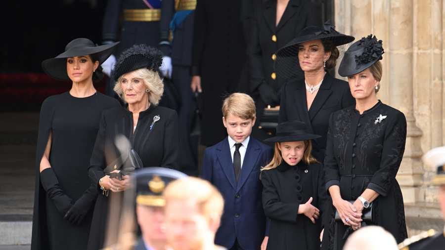The State Funeral Of Queen Elizabeth II LONDON, ENGLAND - SEPTEMBER 19: (L-R) Meghan, Duchess of Sussex, Camilla, Queen Consort, Prince George of Wales, Catherine, Princess of Wales, Princess Charlotte of Wales and Sophie, Countess of Wessex during the State Funeral of Queen Elizabeth II at Westminster Abbey on September 19, 2022 in London, England. Elizabeth Alexandra Mary Windsor was born in Bruton Street, Mayfair, London on 21 April 1926. She married Prince Philip in 1947 and ascended the throne of the United Kingdom and Commonwealth on 6 February 1952 after the death of her Father, King George VI. Queen Elizabeth II died at Balmoral Castle in Scotland on September 8, 2022, and is succeeded by her eldest son, King Charles III. (Photo by Karwai Tang/WireImage)