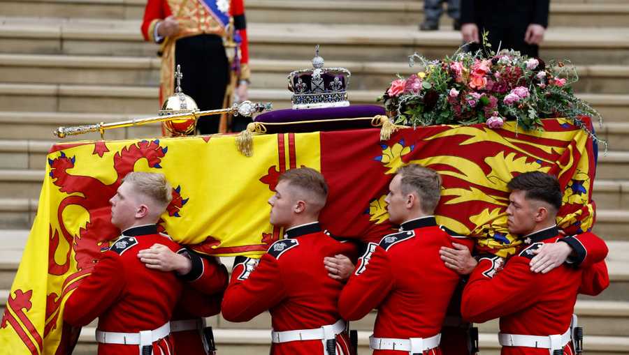 The Committal Service For Her Majesty Queen Elizabeth II WINDSOR, ENGLAND - SEPTEMBER 19: Pall bearers carry the coffin of Queen Elizabeth II with the Imperial State Crown resting on top to St. George's Chapel on September 19, 2022 in Windsor, England. The committal service at St George's Chapel, Windsor Castle, took place following the state funeral at Westminster Abbey. A private burial in The King George VI Memorial Chapel followed. Queen Elizabeth II died at Balmoral Castle in Scotland on September 8, 2022, and is succeeded by her eldest son, King Charles III. (Photo by Jeff J Mitchell/Getty Images)
