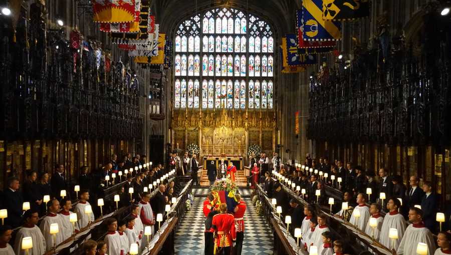 The Committal Service For Her Majesty Queen Elizabeth II WINDSOR, ENGLAND - SEPTEMBER 19: The coffin of Queen Elizabeth II is carried by Pall bearers from the Queen's Company, 1st Battalion Grenadier Guards during the Committal Service for Queen Elizabeth II at St George's Chapel, Windsor Castle on September 19, 2022 in Windsor, England. The committal service at St George's Chapel, Windsor Castle, took place following the state funeral at Westminster Abbey. A private burial in The King George VI Memorial Chapel followed. Queen Elizabeth II died at Balmoral Castle in Scotland on September 8, 2022, and is succeeded by her eldest son, King Charles III. (Photo by Jonathan Brady - WPA Pool/Getty Images)