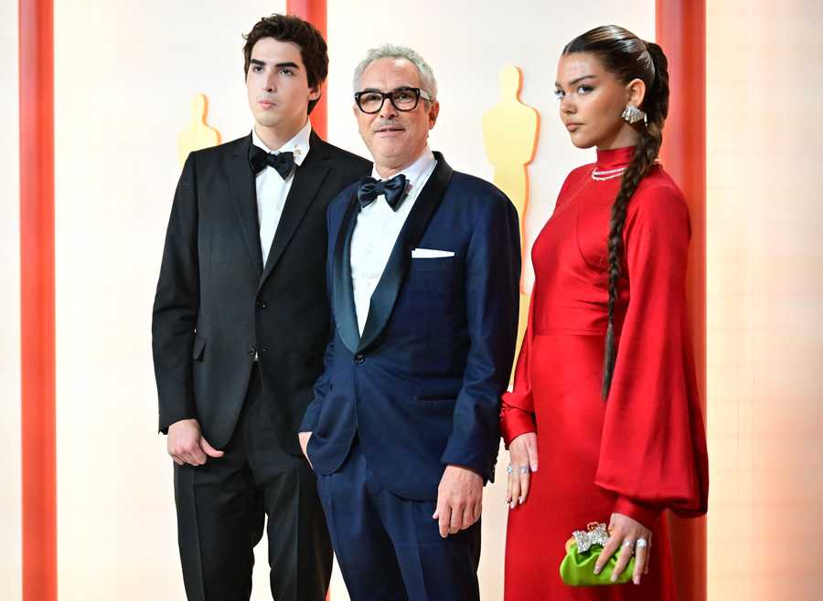 US-ENTERTAINMENT-FILM-OSCARS-AWARD-ARRIVALS-RED CARPET (L-R) Olmo Cuaron, Mexican filmaker Alfonso Cuaron, and Bu Cuaron attend the 95th Annual Academy Awards at the Dolby Theatre in Hollywood, California on March 12, 2023. (Photo by Frederic J. Brown / AFP) (Photo by FREDERIC J. BROWN/AFP via Getty Images)