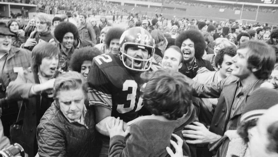 Pittsburgh Steelers' running back Franco Harris is mobbed by fans at Three Rivers Stadium after scoring the winning touchdown, nicknamed the "Immaculate Reception," during the American Football Conference (AFC) semi-final game against Oakland. Harris made the touchdown, one of the most famous single plays in the history of professional American football, on a tipped pass from quarterback Terry Bradshaw to Frenchy Fuqua to Harris for the score in the fourth quarter in Pittsburgh. Pittsburgh Steelers' running back Franco Harris is mobbed by fans at Three Rivers Stadium after scoring the winning touchdown, nicknamed the "Immaculate Reception," during the American Football Conference (AFC) semi-final game against Oakland. Harris made the touchdown, one of the most famous single plays in the history of professional American football, on a tipped pass from quarterback Terry Bradshaw to Frenchy Fuqua to Harris for the score in the fourth quarter in Pittsburgh.