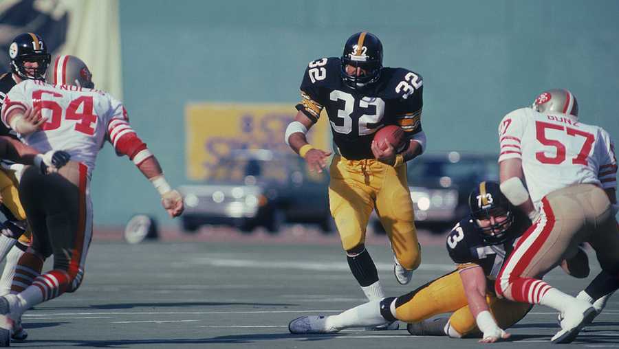Franco Harris #32, runningback for the Pittsburgh Steelers, carries the ball against the San Fancisco 49ers circa the 1970's during a game. Franco Harris #32, runningback for the Pittsburgh Steelers, carries the ball against the San Fancisco 49ers circa the 1970's during a game.